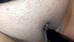 Bondage and hardcore fun with a black dildo