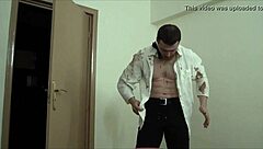 Muscular gay bodybuilder waiter masturbates