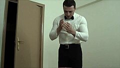 Muscular gay bodybuilder waiter masturbates