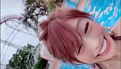 Japanese woman dances sexily with big tits at pool
