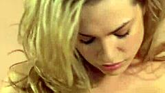 blonde teen whore masturbates on table top