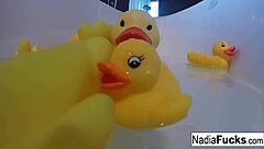 Nadia takes a sensual bath with rubber ducks and masturbates