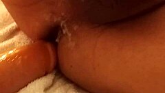 A girl uses a dildo to have sex with a man and gives him pleasure until he cums