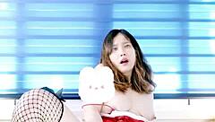 Santa-themed porn with an Asian woman in red underwear