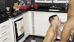 Young guy interacts with big black guy while making coffee