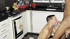 Young guy interacts with big black guy while making coffee