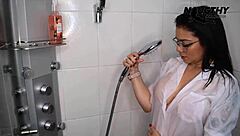 A beautiful brunette gets her lover to film her while she has a shower and masturbates