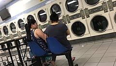 2 Hispanic ladies in flannel skirts at laundromat