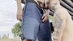 Young gay men having sex in a public place and being watched by others