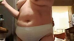 my wife lounges in big panties in the kitchen, teasing me softly