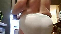 my wife lounges in big panties in the kitchen, teasing me softly