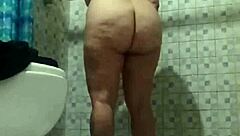 Secretly filming my stepmother while she takes a shower