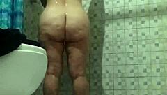 Hidden camera in shower. Spying on mature stepmother.