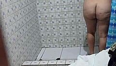 A mature Venezuelan woman next door takes a shower and is secretly videotaped