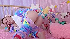 A beautiful amateur, dressed in her baby doll nightie, plays with her backdoor using an anal toy