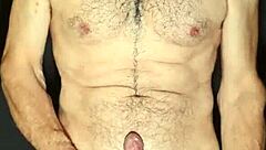 Gay man exhibits big cock and masturbates
