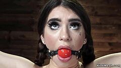 Pale brunette in hogtie bondage position