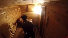 A black guy gets a blowjob and cum inside a sauna in a hidden camera video