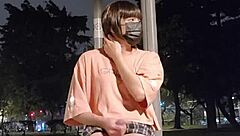 Ladyboy Tingxuan pees outdoors while masturbating with dildo under skirt