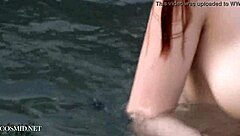 Misha Lowe flaunts massive tits by the pool