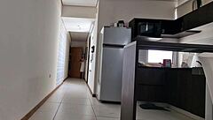 Young European teen interacts with the Spanish pizza delivery guy