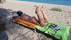 natural girl enjoys nudism on public beach