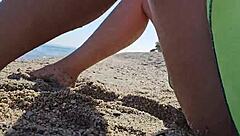 Beautiful naturist scenes of a brunette woman at a public beach