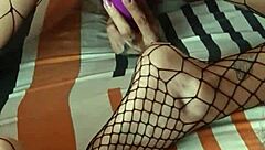 Foot fetish guy fucks her deliciously, cumming on her fishnet feet.