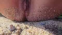 Beautiful naturist scenes of a brunette woman at a public beach