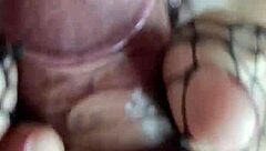 Foot fetish guy fucks her deliciously, cumming on her fishnet feet.