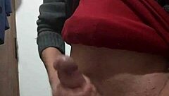 i'm jerking off with my clothes on, feeling the skinny cock in my hand as i masturbate alone.