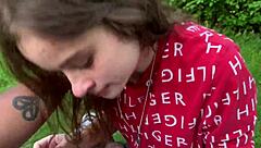 Beautiful women with blue eyes give blow jobs in a park