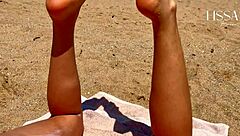A man I don’t know gives me a blow job on a public beach