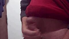 i'm jerking off with my clothes on, feeling the skinny cock in my hand as i masturbate alone.