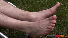 Young and straight twink gives foot job to a hot hunk in gay porn video