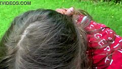 Beautiful women with blue eyes give blow jobs in a park