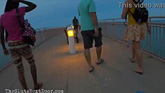 Hot girls give each other hand jobs at the beach