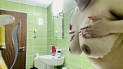 Solo play in the shower with huge cans and round ass