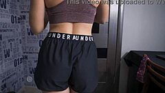 Beautiful woman showing off her ass in Under Armour shorts during sports activities