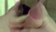 Exhibitionist pleasuring himself in public restroom
