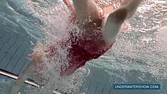 Katya feels free in red dress at pool.