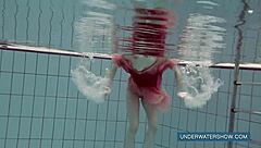 Katya feels free in red dress at pool.