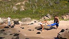 A beach orgy with anal sex and lots of moaning