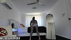 Beautiful woman in bikini trying out lit up butt plug