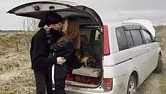 A hot scene of a couple having sex in the back of a car
