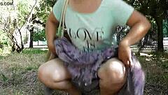A hot mature woman with hairy pussy in a transparent dress