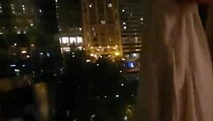 The guy wanking his cock in the hotel window