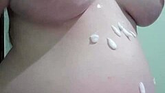pregnant woman enjoys cream and massage session