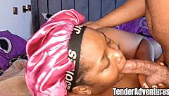 Early in the morning, a black couple engaged in gentle intimacy