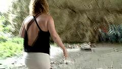 A mature woman is fucking with a guy on the beach